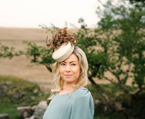 Cream leather pillbox hat with pheasant feathers