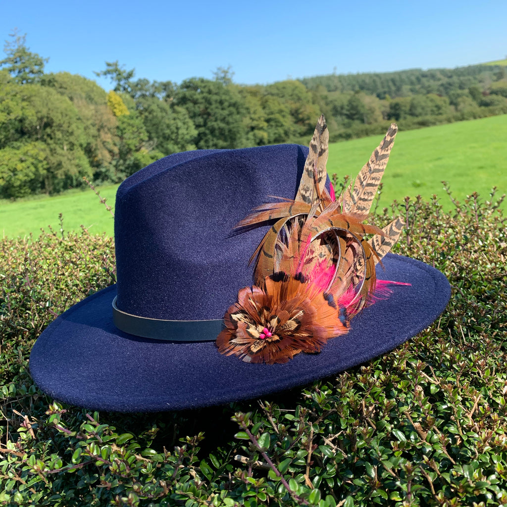 Navy fedora embellished with natural game bird feathers